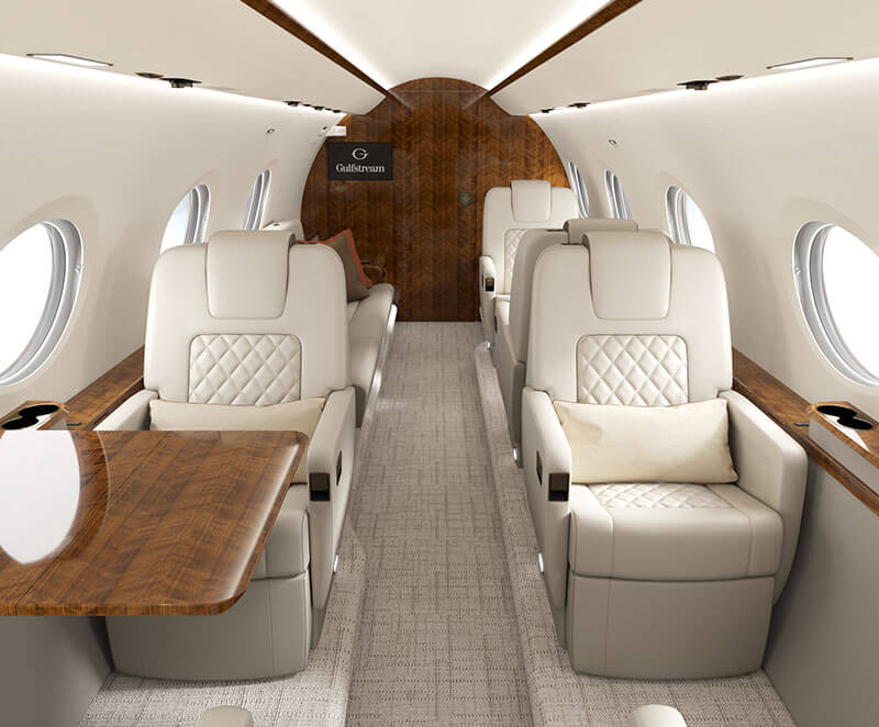 A Gulfstream G300 classic interior highlighting elegant single seats and a deployed table.