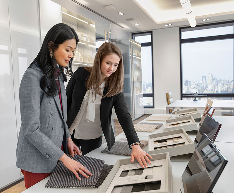 Gulfstream employees look over fabric samples at the Gulfstream Manhattan Sales and Design Center Showroom.